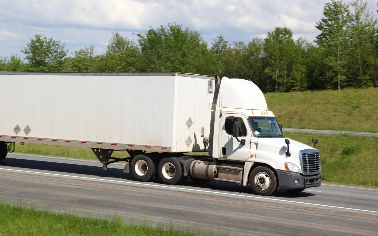 Semi trailer parked on the roadside awaiting repair