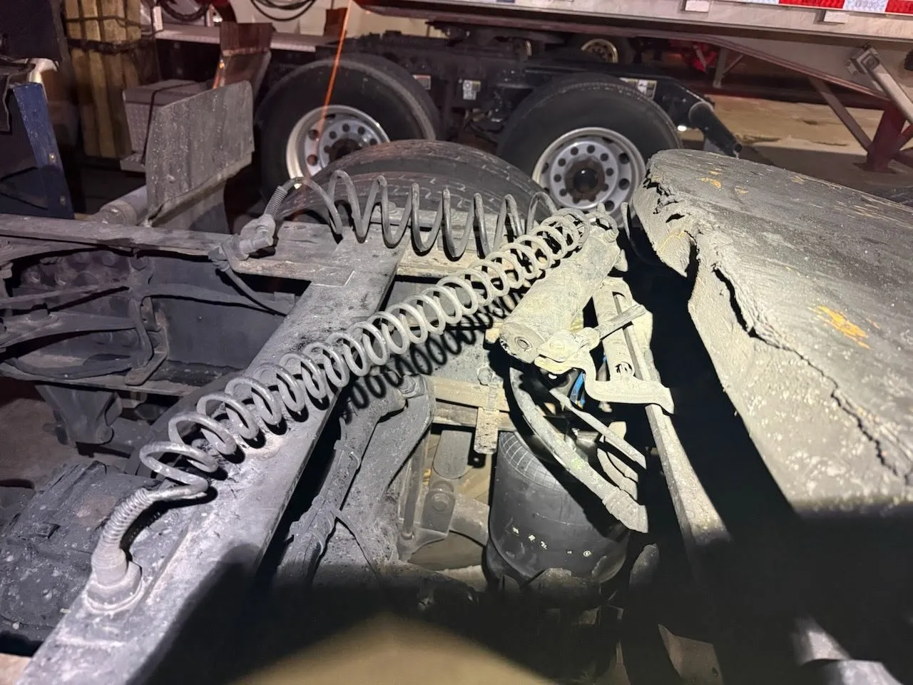 Semi trailer air line repair being carried out