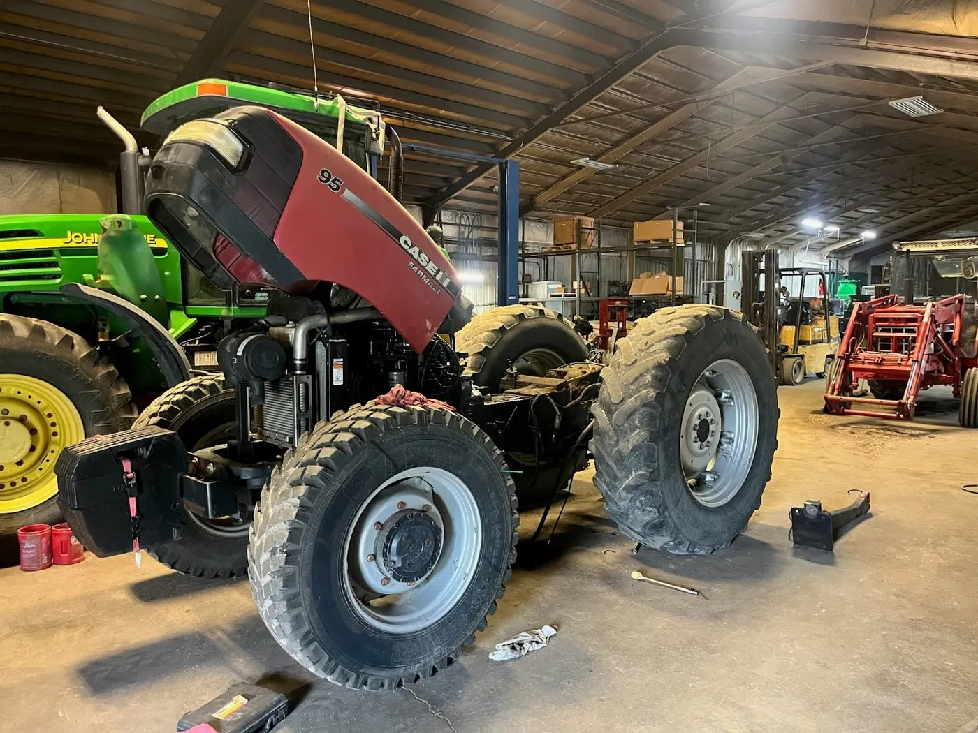 Case IH tractor being serviced in a repair shop