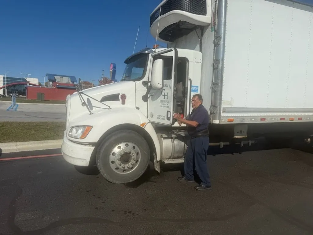 Refrigerated box truck receiving roadside repair