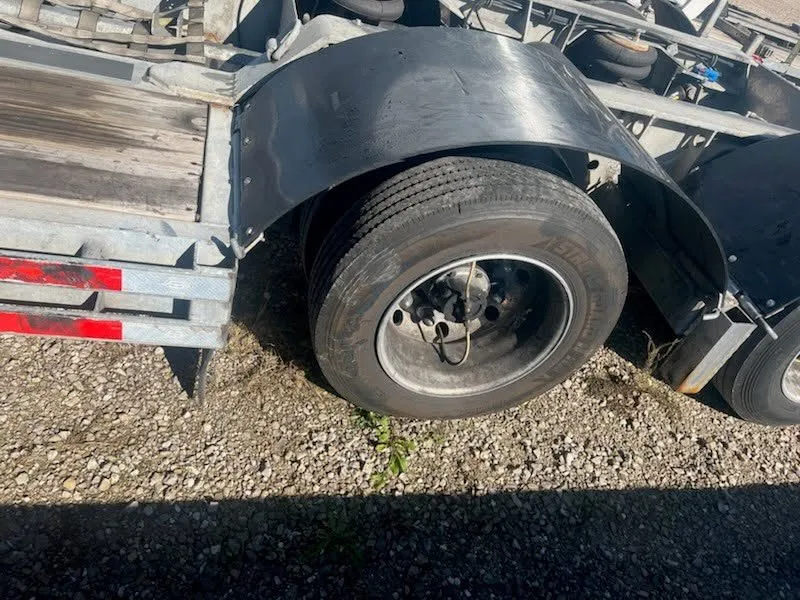 Trailer tire and wheel repair in progress