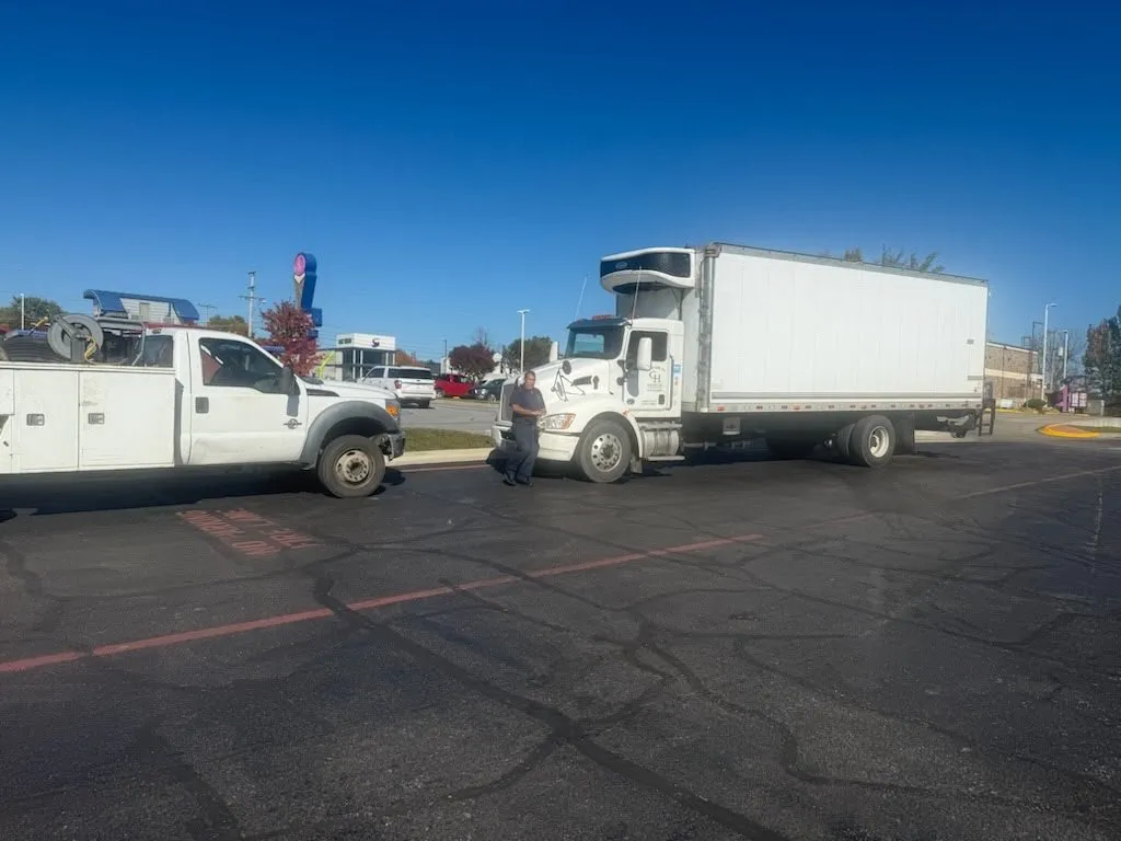 Mobile service truck assisting a box truck at the roadside