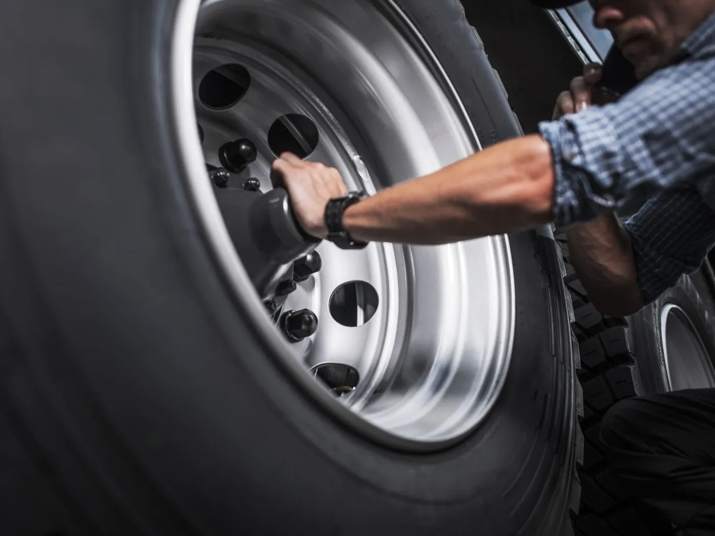 Close view of a commercial truck wheel and tire
